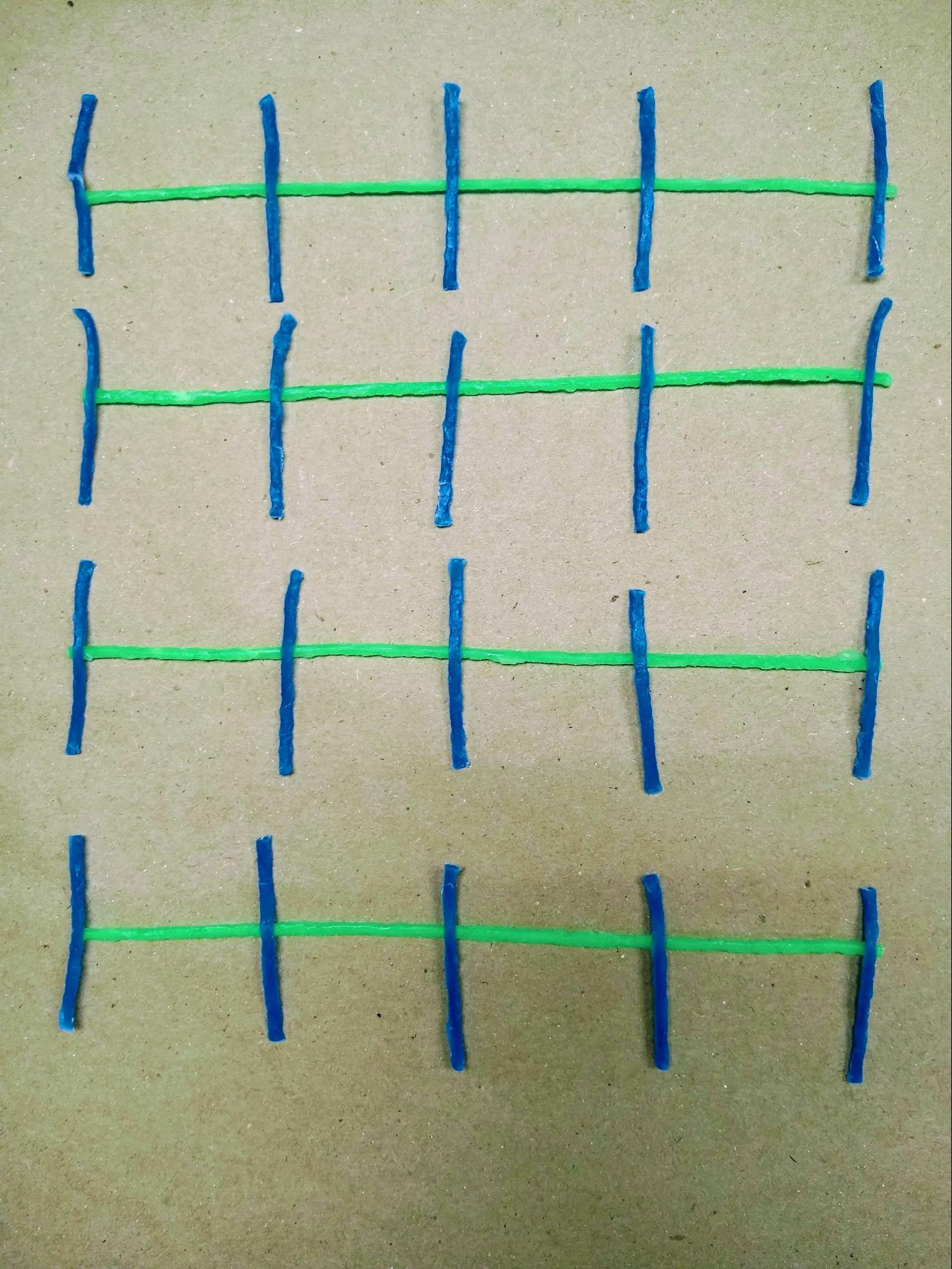 An abstract pattern made from colorful pieces of string from the Idea Lab